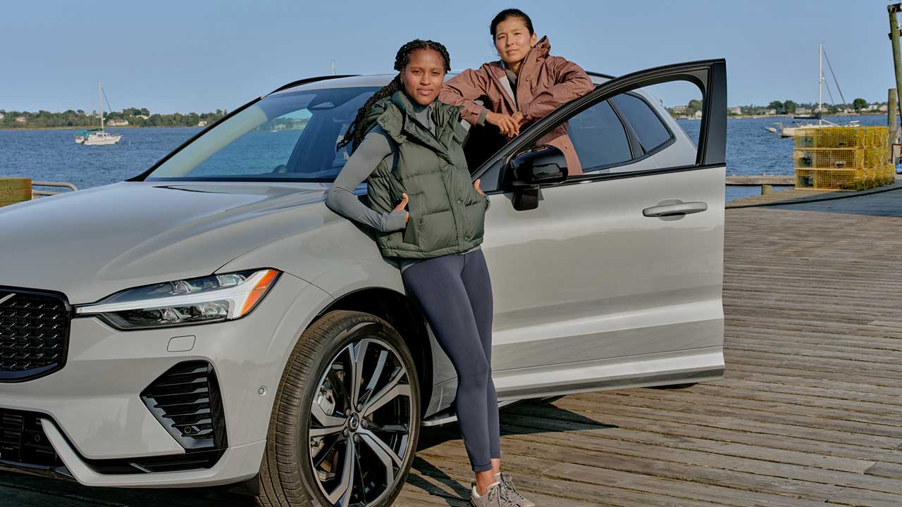 2 womean in a volvo on a pier