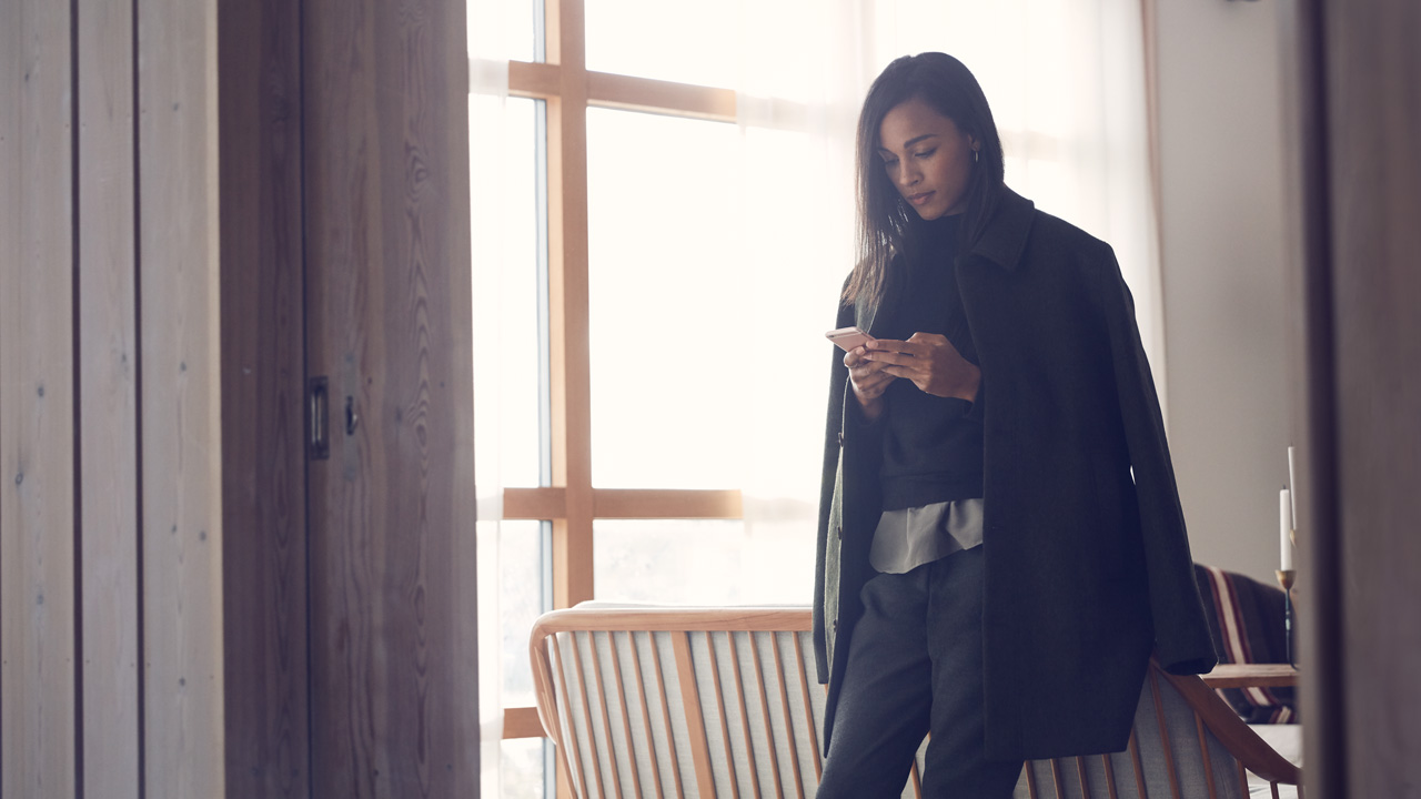 Woman with jacket on cellphone