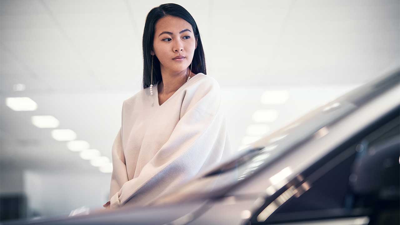 woman browsing new Volvo