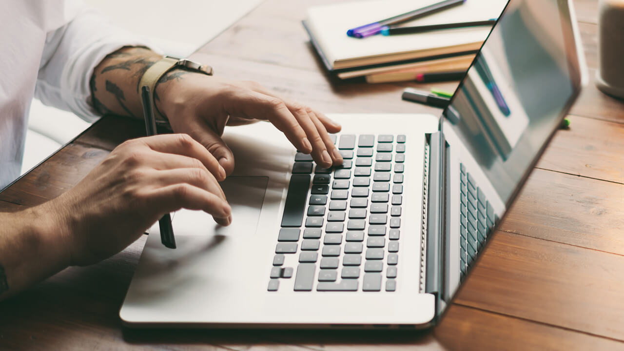 Man on laptop at desk