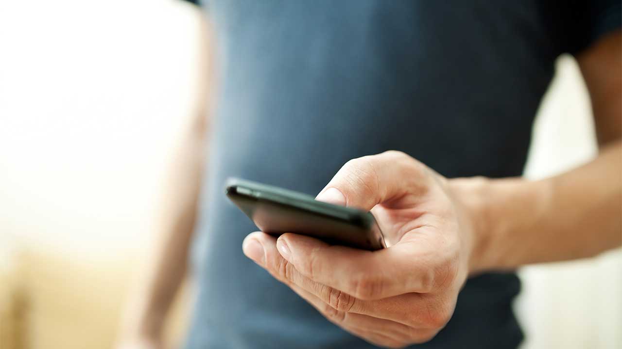 man holding his smartphone