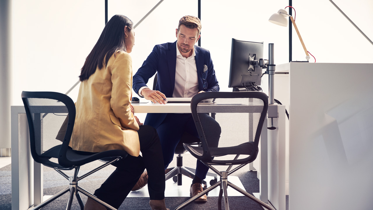 Volvo Customer Service sitting at desk 