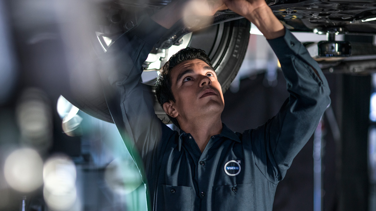 Volvo Service Technician under lift